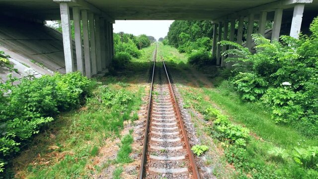 Aerial view of a train track in the countryside. 4k stock footage.