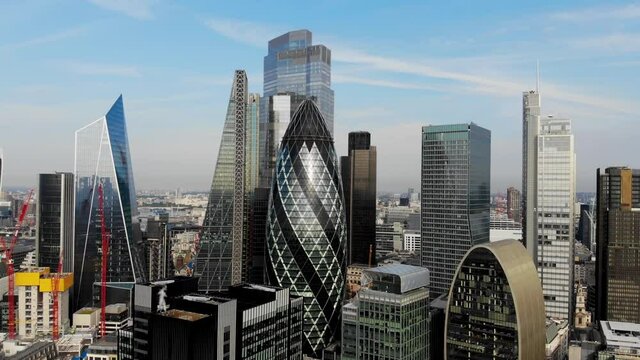 Reverse aerial view of the City of London skyline, the Gherkin, the Cheesegrater, the Scalpel and the Walkie Talkie Building on a sunny summer morning