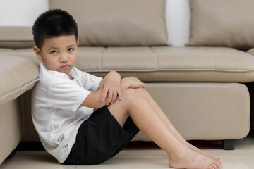 Asian child  sitting alone with sad feeling, Concept for bullying, depression stress or frustration