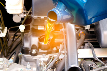 Refueling and pouring oil quality into the engine motor car Transmission and Maintenance Gear...