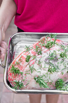 prepared lamb leg reading for roasting, with garlic, rosemary, salt and olive oil