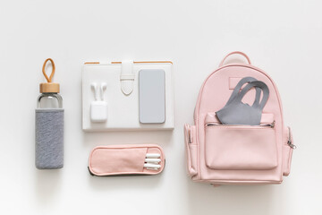 Female backpack stationery, clothes. Student bag storage organization. Concept of back to school