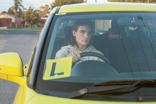 Teenage boy learning to drive