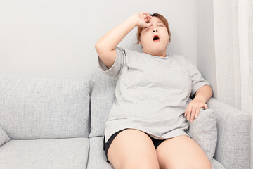 Asian fat girl sitting on the sofa