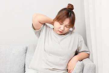 Asian fat girl sitting on the sofa
