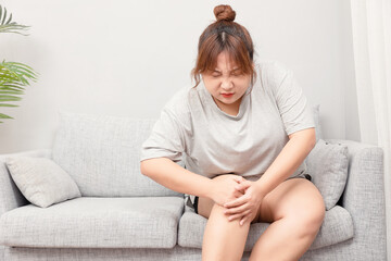Asian fat girl sitting on the sofa