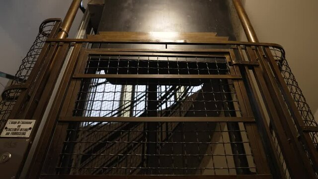 Empty old vintage elevator ascending in the building