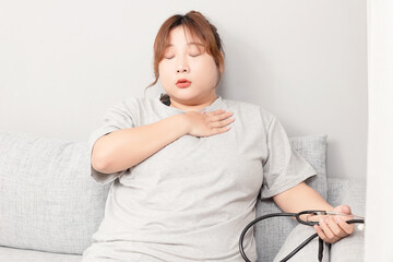 Asian fat girl sitting on the sofa
