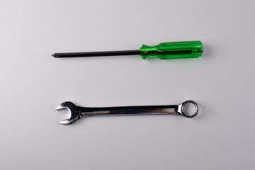  Screwdriver and wrench on white background. Top view.