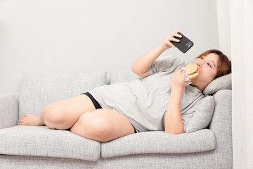 Asian fat girl sitting on the sofa