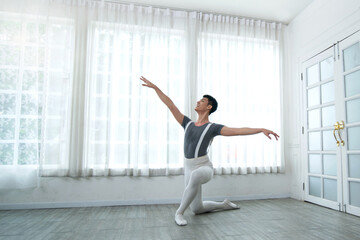 Handsome young male dancer practice dance an exercise at home, social distance during quarantine