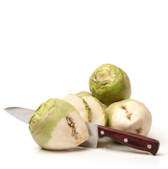 Fresh kohlrabi with green leaves on isolated white backround
