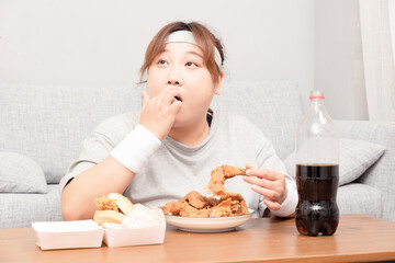 Asian fat girl drinking fried chicken