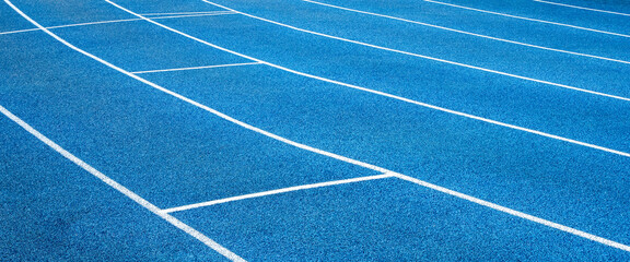 Blue running treadmill track with lane in-stadium outdoors.banner image.