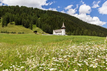 Church of the dear Lady, Frauenkirch on the green hill, in Davos district, Grisons, Switzerland