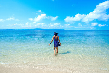 woman in blue dress on the beach, at leela beach koh phangan ,suratthani,thailand