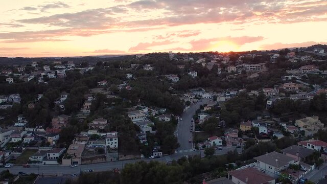 Spanish neighborhood in the mountains at sunset, aerial