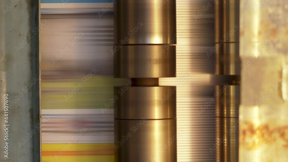 Aufkleber turbine of print machine visible at high speed turning to pull printed papers through the printworks