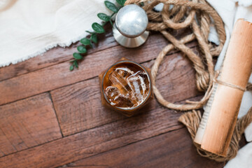 Close-up of iced coffee served on black table at cafe​