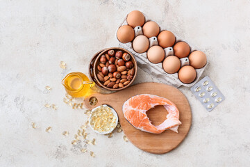 Composition with fish oil pills on light background