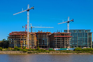 Fototapeta na wymiar Construction of a new residential area on the banks of the Fraser River in Richmond City, Canada