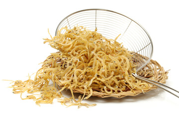 Dry preserved small fishes on white background