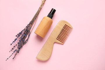 Hair comb, bottle of cosmetic product and lavender on color background