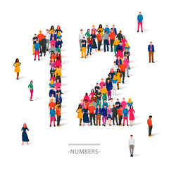 A large group of people is standing in colored clothes in the shape of the number 12. The concept of human numbers.