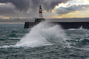 Misty and stormy day at Fraserburgh Harbour Lighthouse, Aberdeenshire, Scotland, UK.