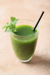 Glass of healthy green smoothie with parsley and spinach on color background
