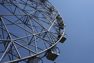 Ferris wheel design on a blue sky background
