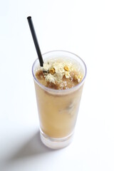 homemade cook ice cold chilled yellow Chrysanthemum flower tea in tall glass white background beverage menu