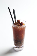 hand made ice cold chilled honey longan fruit red date herbal tea in tall glass healthy beverage menu