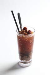 hand made ice cold chilled honey longan fruit red date herbal tea in tall glass healthy beverage menu