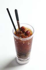 hand made ice cold chilled honey longan fruit red date herbal tea in tall glass healthy beverage menu