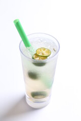 ice cold chilled fresh sour lime fruit honey drink in glass and green straw beverage menu in white background