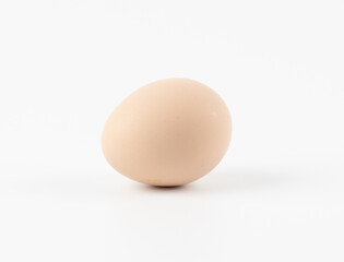 Single brown egg isolated from white background