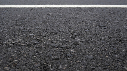 Surface grunge rough of asphalt, Grey with white line on the road and small rock, Perspective...