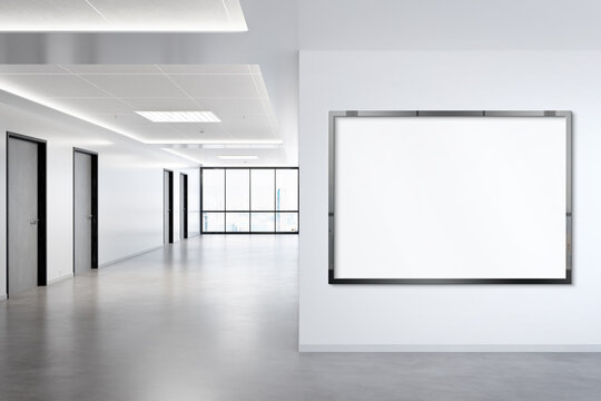 Black horizonal frame Mockup hanging on wall. Mock up of a billboard in modern concrete office interior 3D rendering