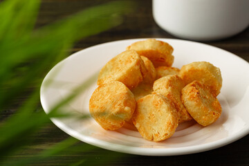 Baked small cheese cookies heap close up