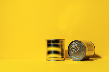 Canned food tin on yellow studio background