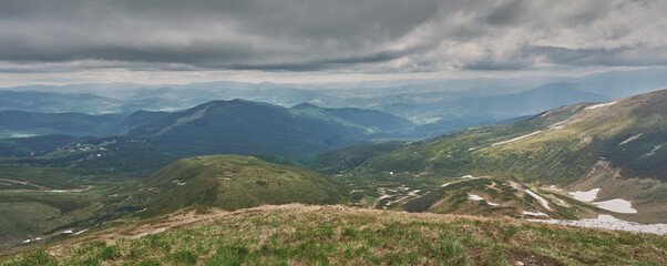 Clouds over the mountains. Sunny day in the mountains. Ukrainian Carpathian mountains. Svidovec ridge.