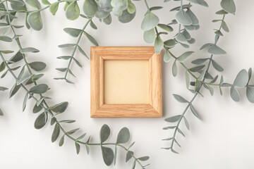 Wooden frame mockup with decor plant