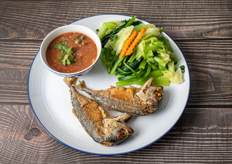 Fried Mackerel with Shrimp Paste Sauce and scald vegetable (nam prik kapi pla too). Thai traditional food.