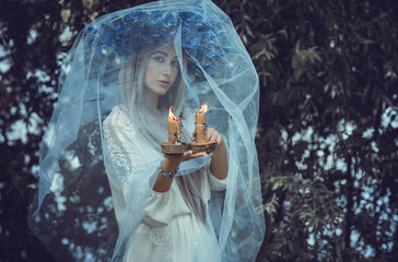 Bride making magic of candles, magical attributes, herbs and flowers, Slavic/ Wicca rituals and...