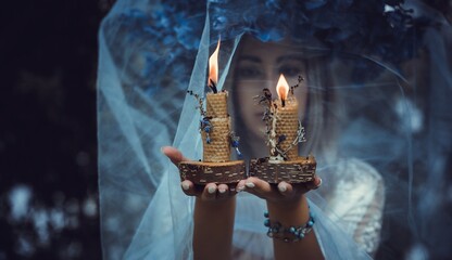Bride making magic of candles, magical attributes, herbs and flowers, Slavic/ Wicca rituals and...