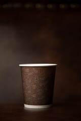 Brown Paper Coffee Cup On Vintage Background