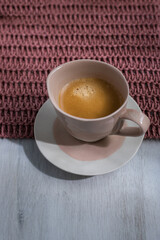 Pink and white ceramic isolated cup of hot delicious coffee.
