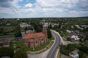 Neo-Gothic Catholic Church of the Sacred Heart of Jesus in Stoyaniv, Ukraine. Aerial view from drone
