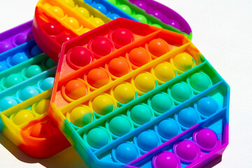 Colorful antistress pop it toy on white background